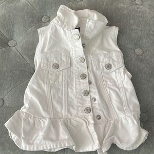 White jean vest. Small stain not able to be seen when buttoned
